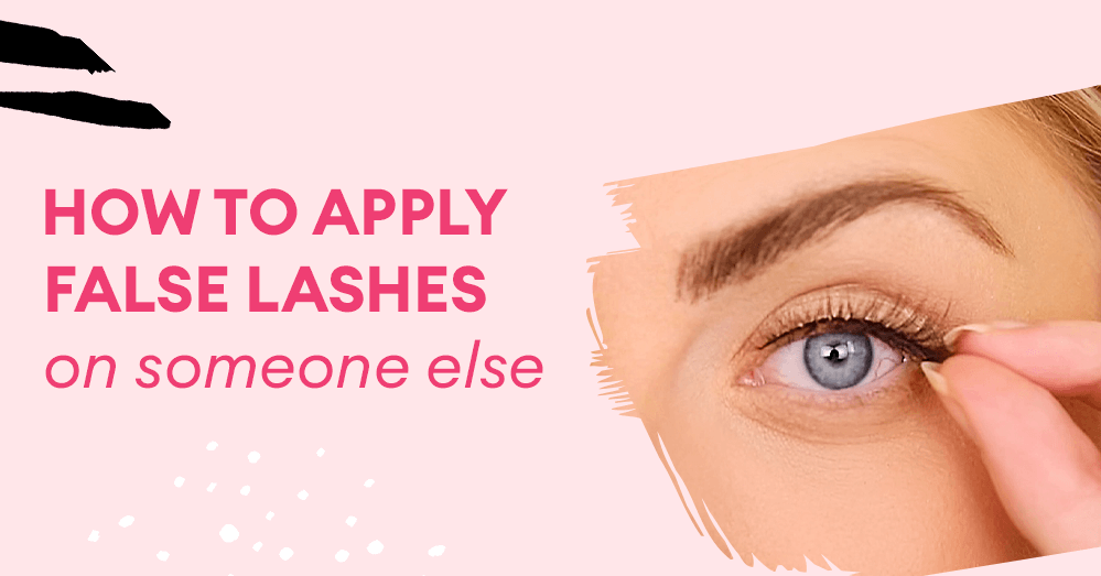 a woman applying fake eyelashes on her friend