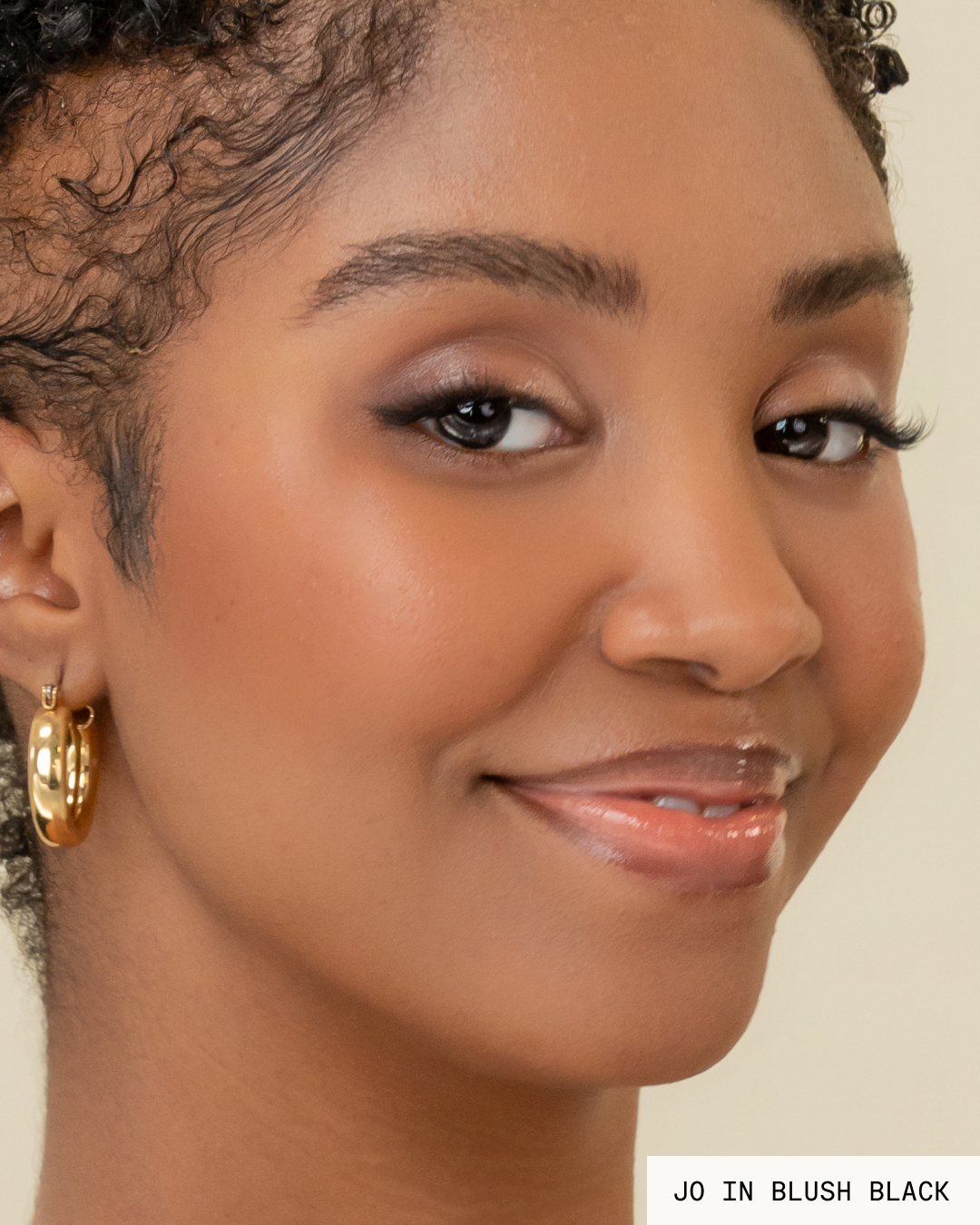 Model Jo with dark hair and skin wearing Blush Pop-On Lashes: Single Size Clusters in black