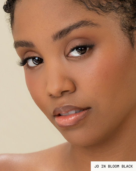 Model Jo with dark hair and skin wearing Bloom Pop-On Lashes: The Extensions Set in black