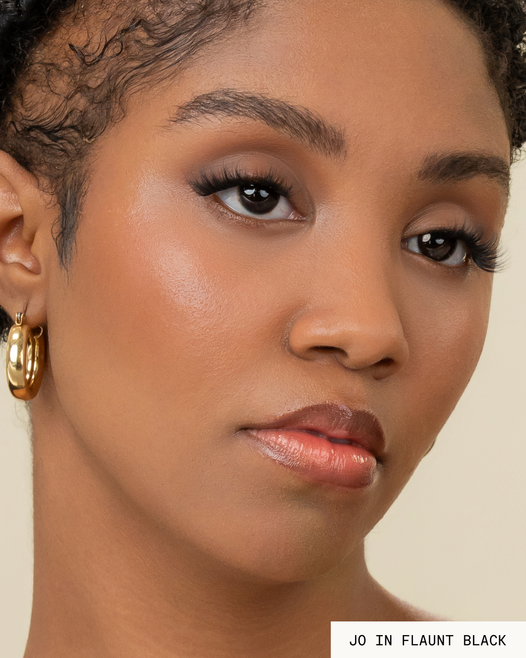 Model Jo with dark hair and skin wearing Flaunt Pop-On Lashes: The Extensions Set in black