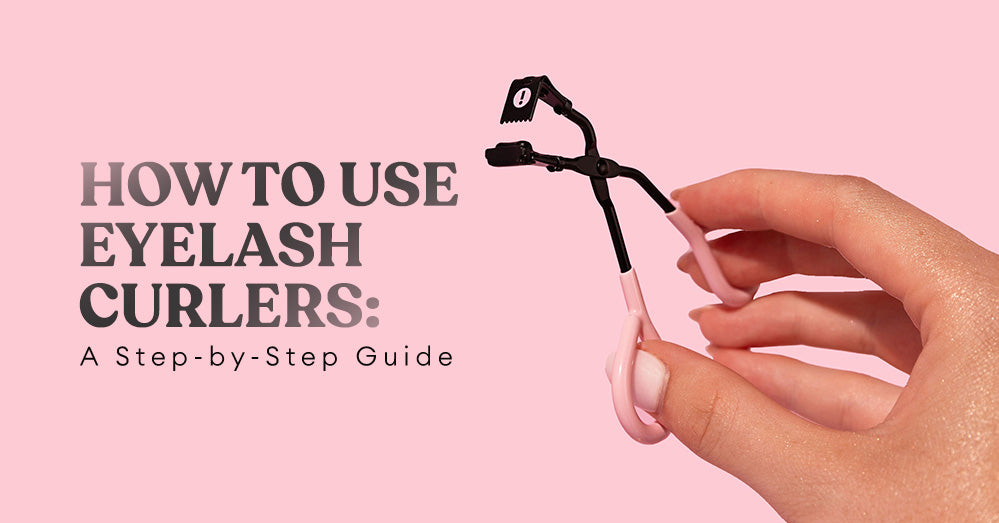 how to use eyelash curlers: a hand holding a pair of eyelash curlers