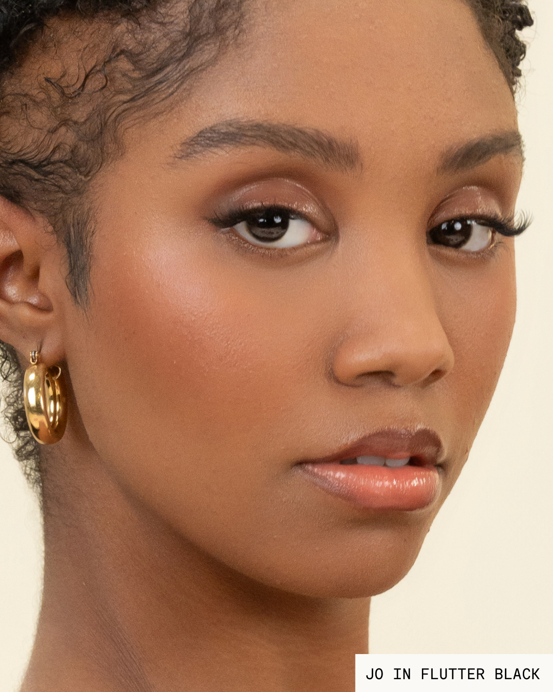 Model Jo with dark hair and skin wearing Flutter Pop-On Lashes: The Extensions Set in black