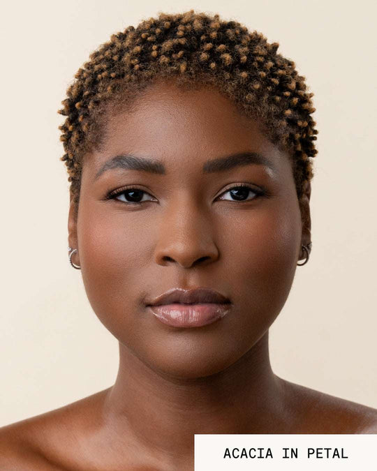 Model Acacia wearing lip gloss revival petal