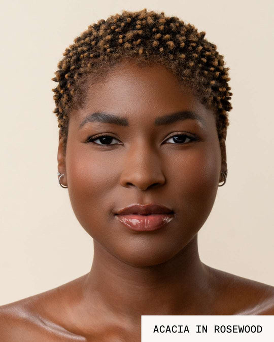 Model Acacia wearing lip gloss revival rosewood