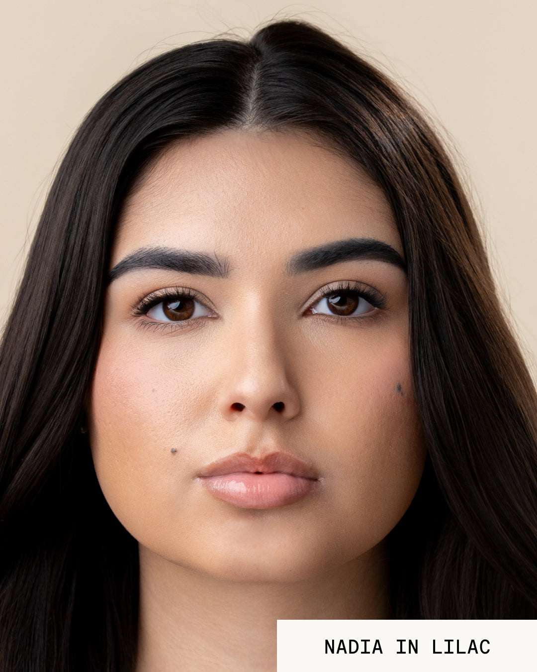 Model Nadia wearing lip gloss revival lilac