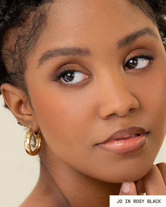 Model Jo with dark hair and skin wearing Rosy Pop-On Lashes: The Extensions Set in black