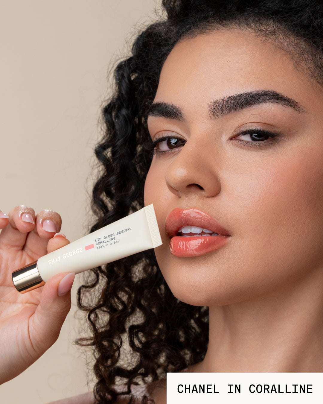 Model Chanel holding lip gloss revival coralline tube