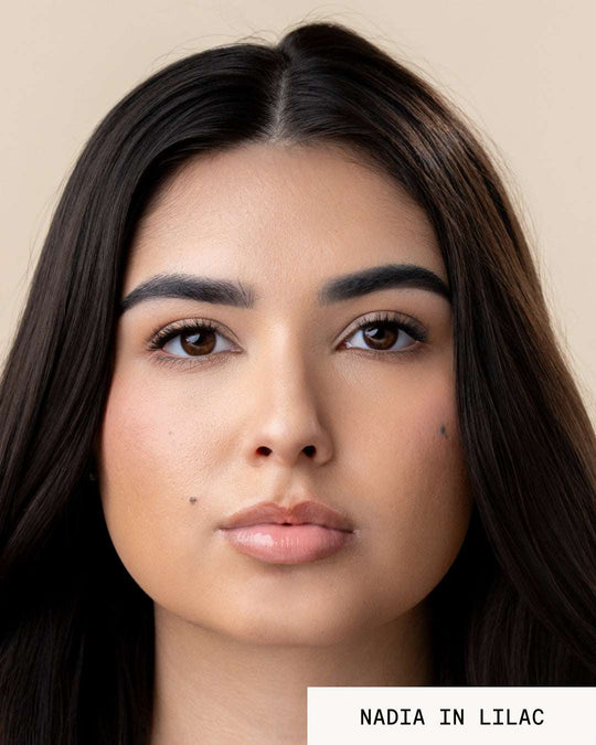 Model Nadia wearing lip gloss revival lilac