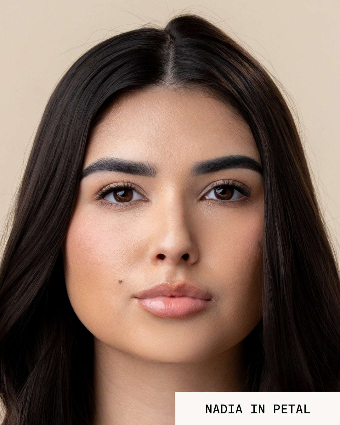 Model Nadia wearing lip gloss revival petal